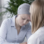 Image of Chemo patient doing paperwork